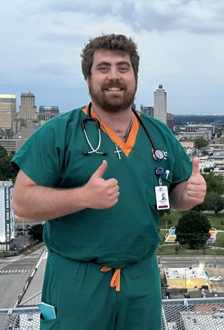 Joshua Archer standing in front of the Memphis skyline.