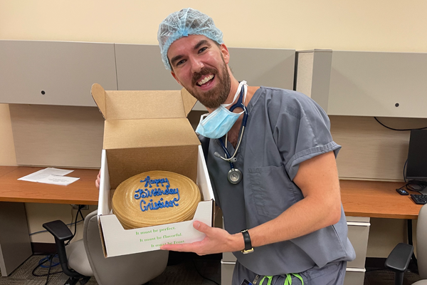 Resident holding his birthday cake