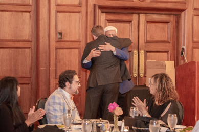 2021 Graduation attendees hug