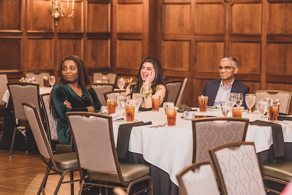 Graduation attendees sitting at a table