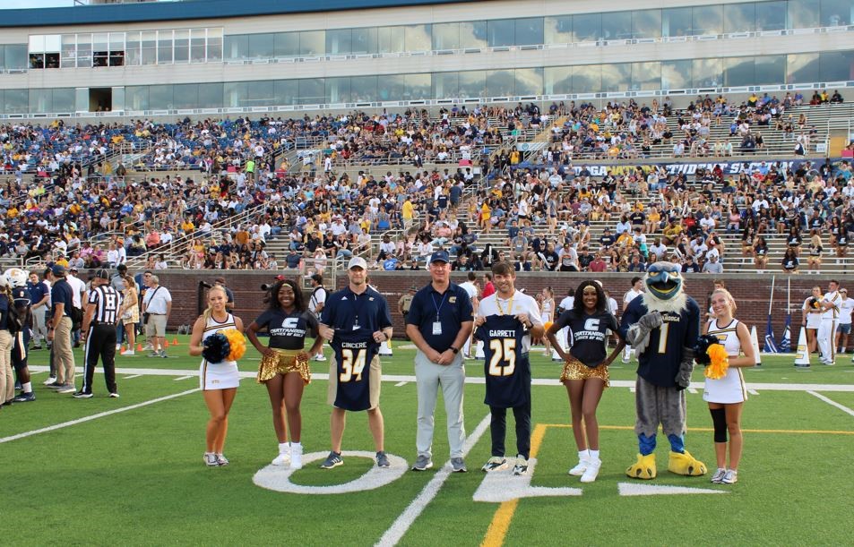 UTC Football recognizing Drs Garrett and Cincere