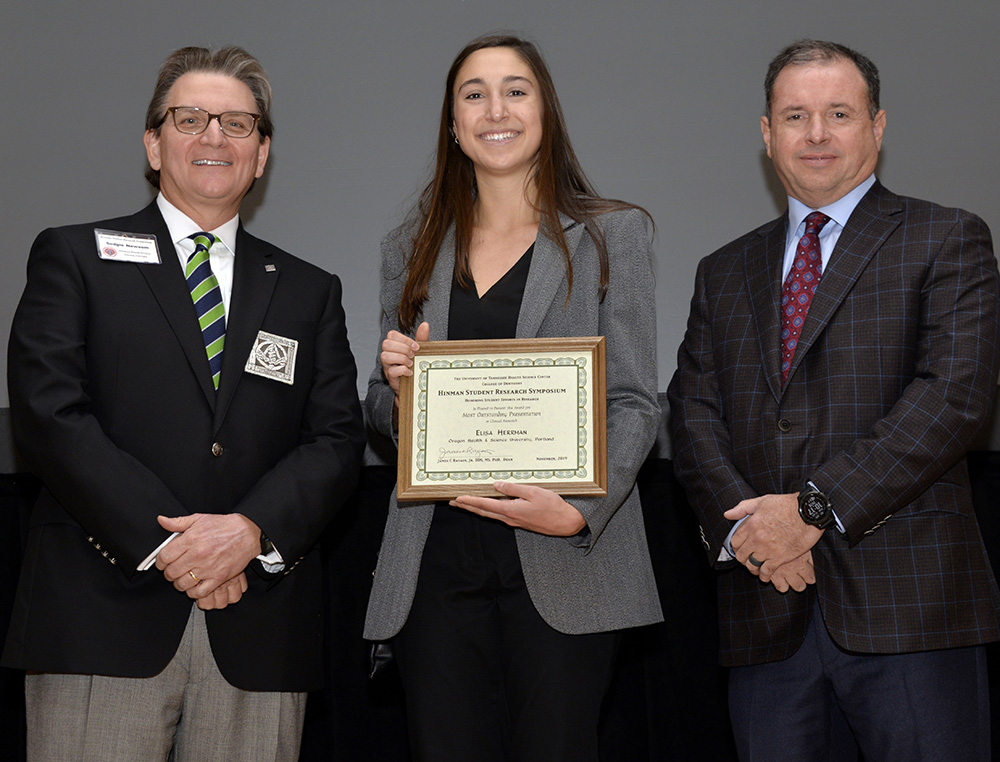 student with plaque