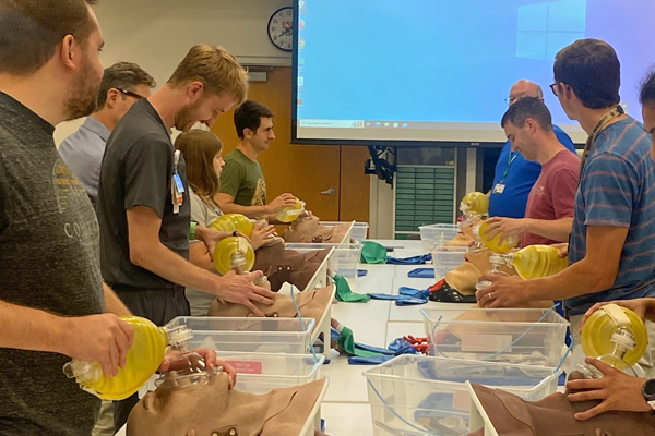 Residents performing procedures in a lab