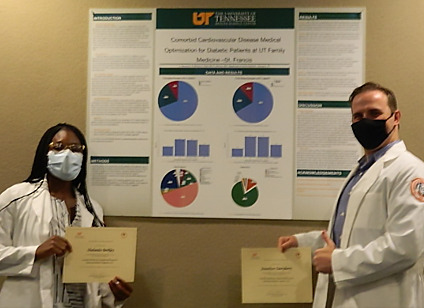 Residents before a research poster