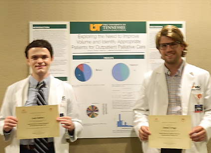 Residents before a research poster