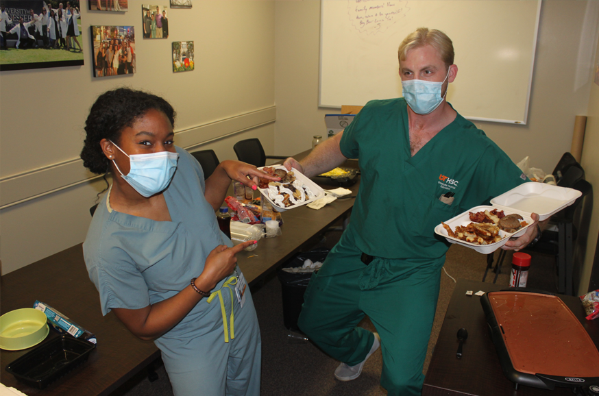 Two residents showing off lunch