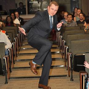 Graduate walking down the aisle