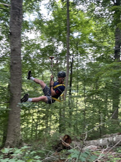 Resident outdoors ziplining