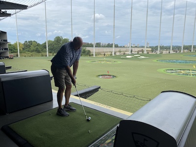 Faculty at a golf range