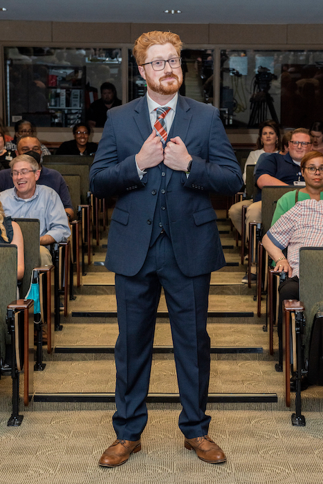 Resident walking the aisle at graduation