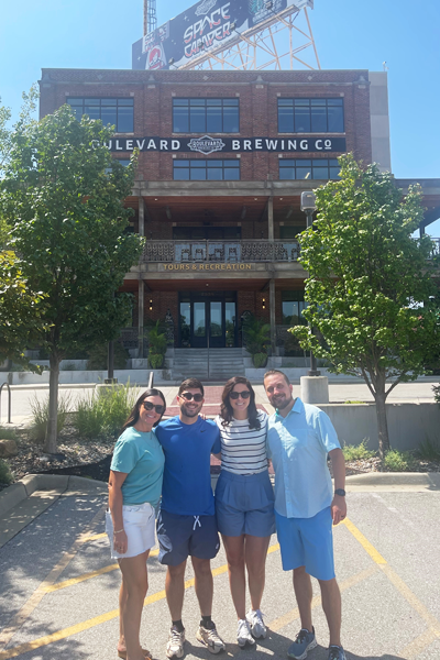 Residents and families outside a brewing co in Kansas City on a sunny day