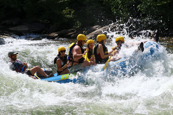 Residents on a raft in the rapids