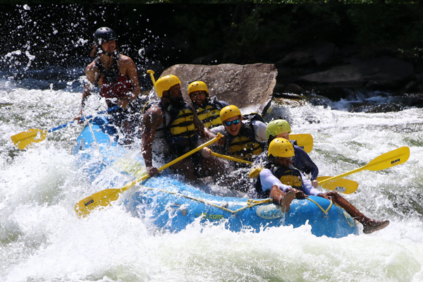 Residents on a raft in the rapids