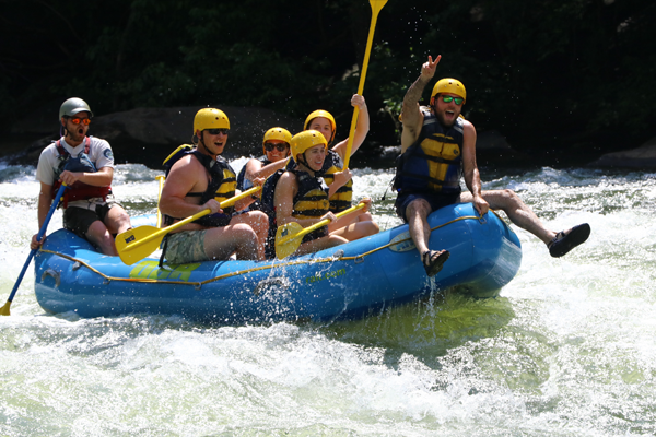 Residents on a raft in the rapids