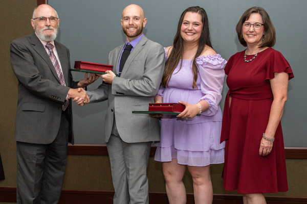 Faculty presenting residents with certificates