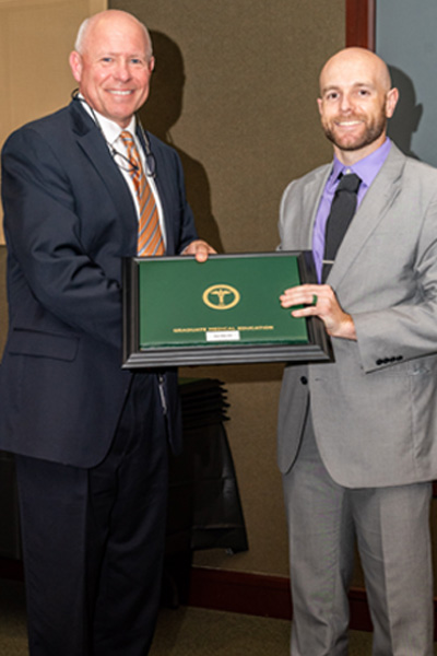 Program Director and resident with certificate