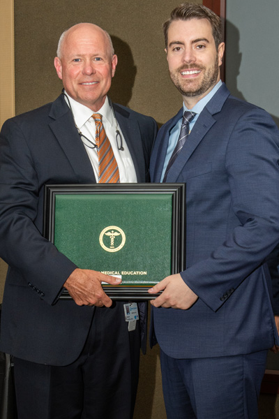 Program Director and resident with certificate