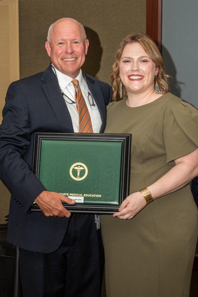 Program Director and resident with certificate