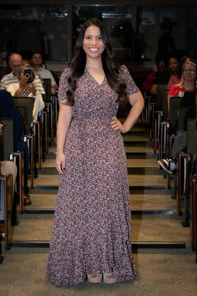 Female resident walking the aisle at graduation