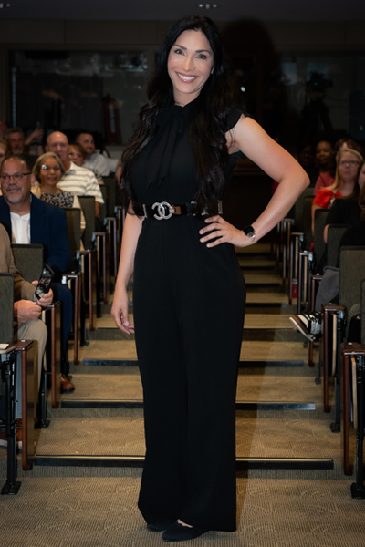 Female resident walking the aisle at graduation