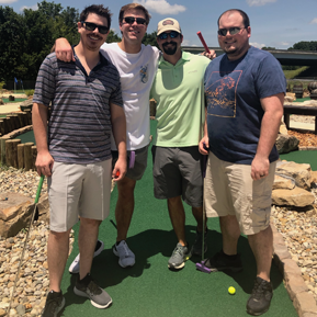 Residents playing putt-putt