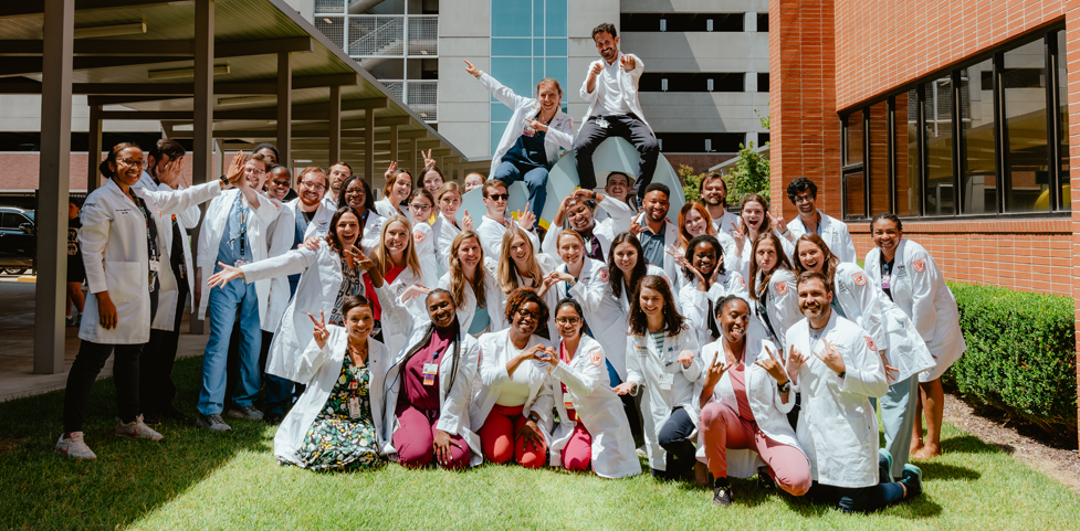 med peds residents outside by a UT sign