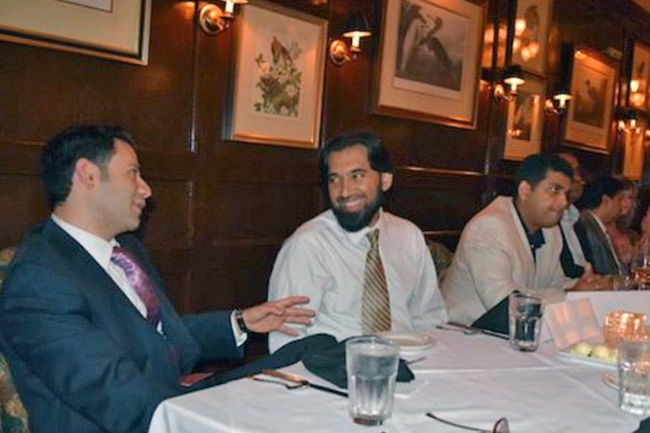 Two Nephrology fellows talking at the 2016 graduation dinner