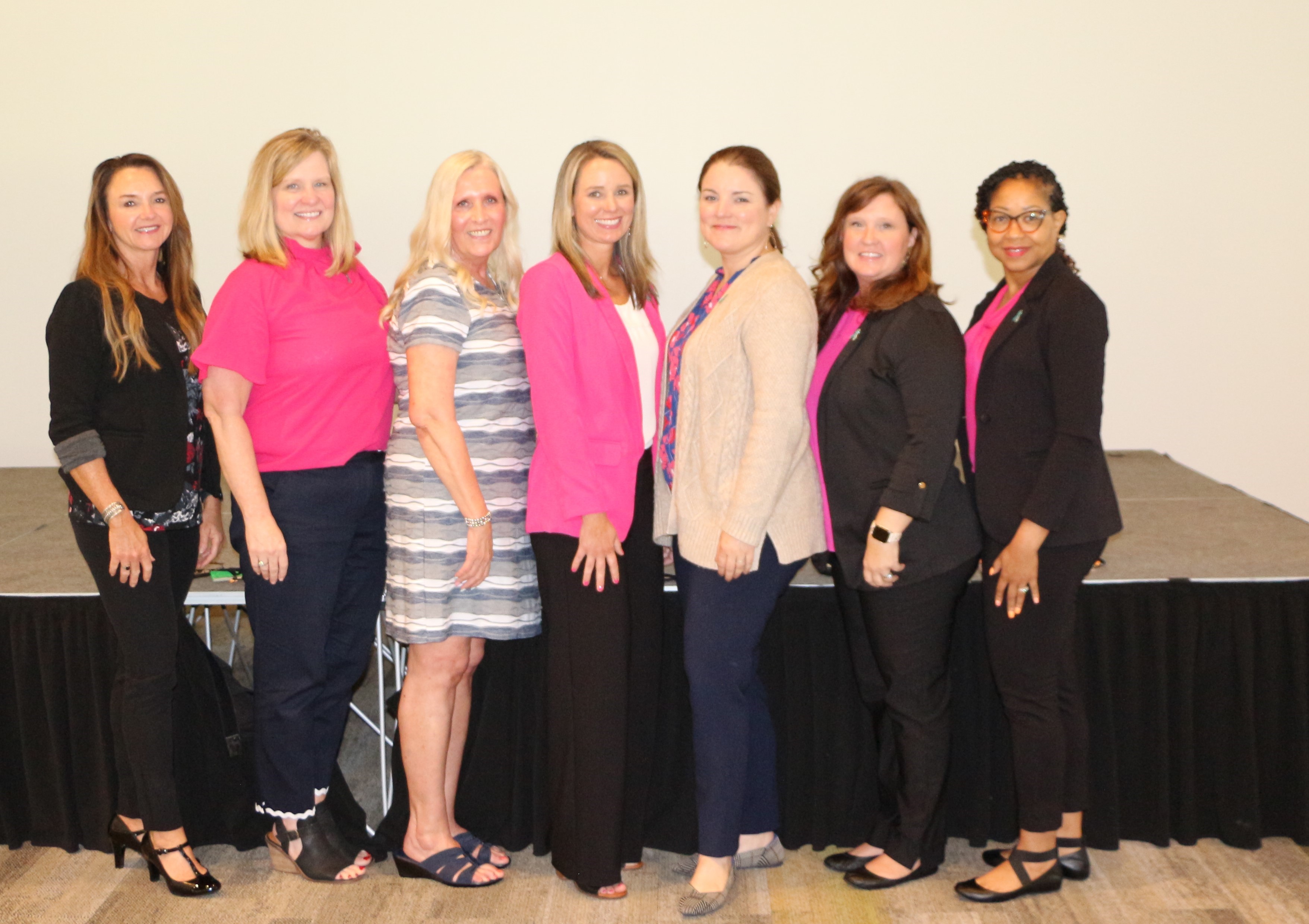 Women wearing pink jackets