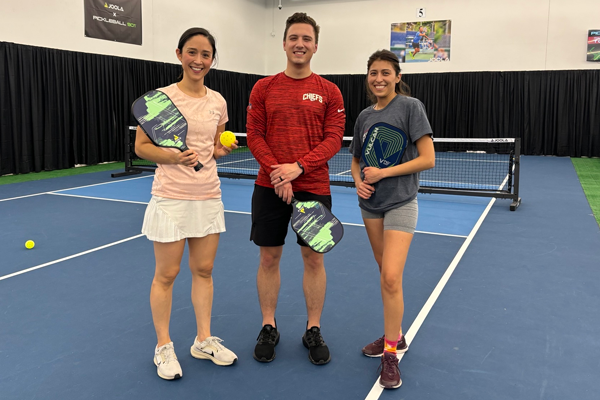 Fellows on an indoor tennis court