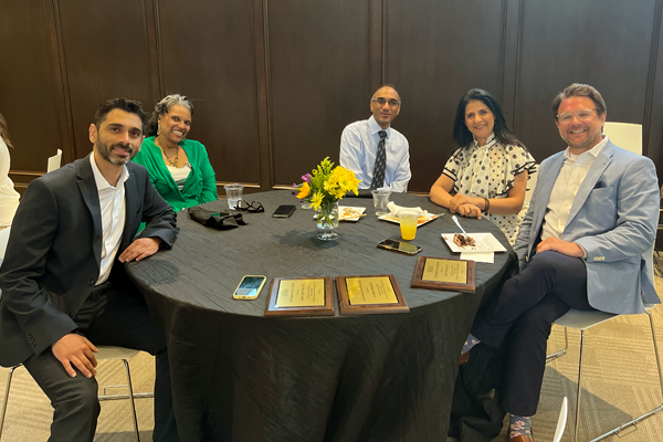 Residents at a table in an indoor setting