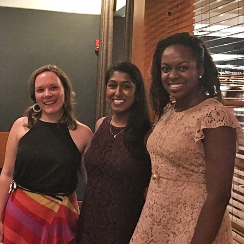 Three female fellows at graduation