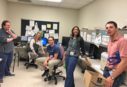 Smiling fellows in an office setting