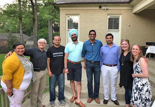 Smiling fellows and faculty outside