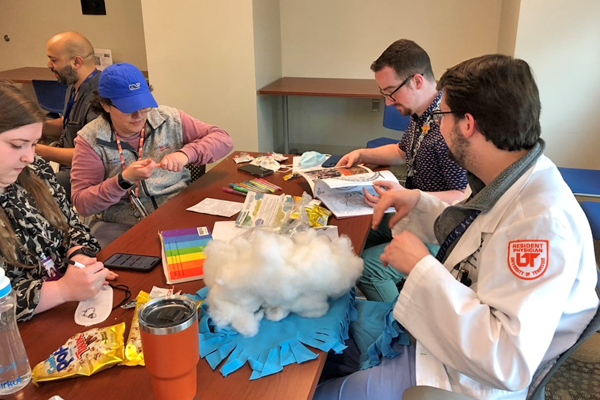 Residents sitting at a classroom table