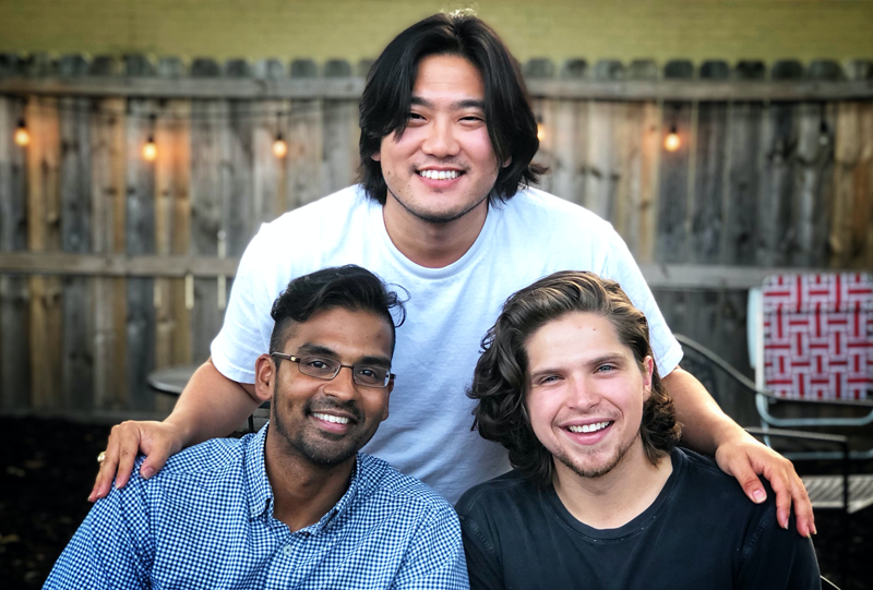 Three male residents in an outside settiing