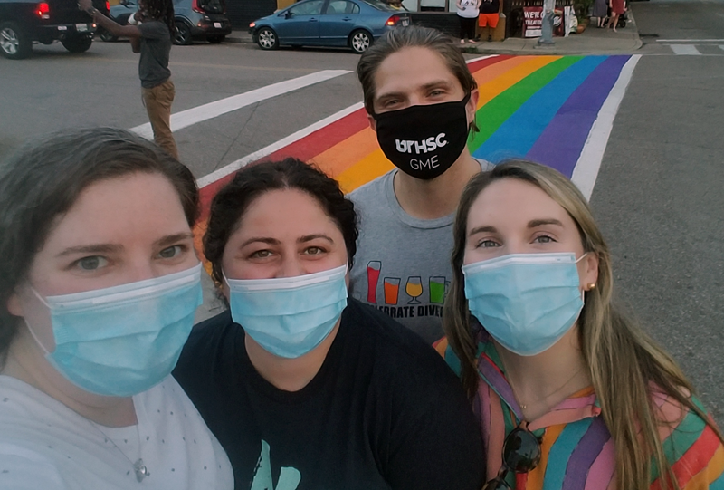 Four residents wearing masks