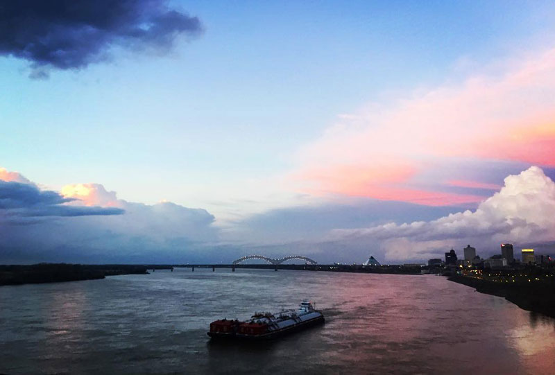 View of the river with a barge on it