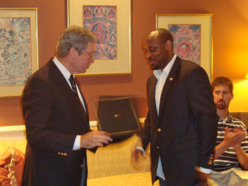 Fellow receiving a certificate at the graduation dinner