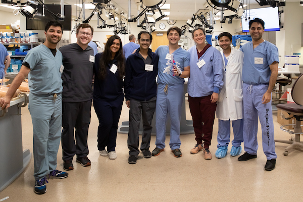 Group of fellows and faculty in a clinical training setting