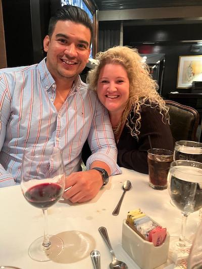 Two fellows sitting together at a dinner table