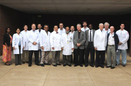 Faculty and fellows outside the Coleman Building