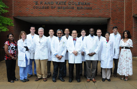 Faculty and fellows outside the Coleman Building