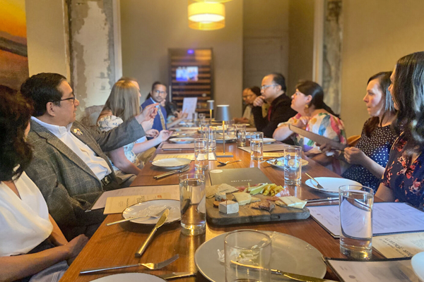 Faculty and fellows are graduation dinner table