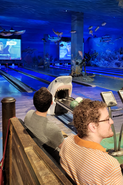 Residents bowling in the Bass Pro Shop