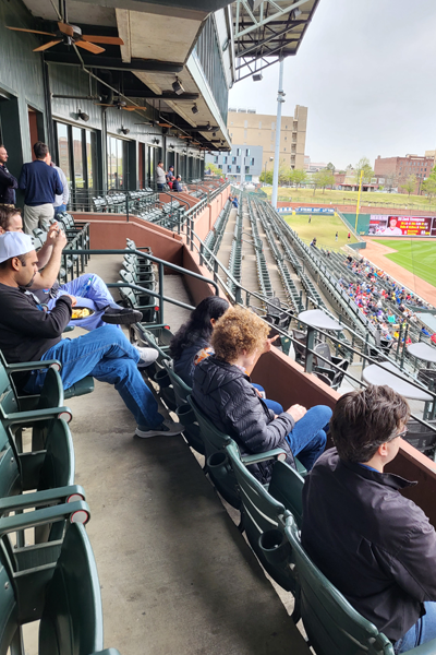 Residents sitting in the stadium outside the box seat room