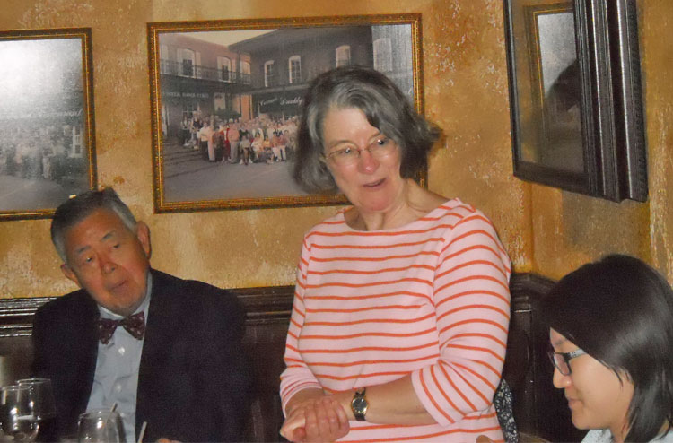 Lady speaking at the graduation table